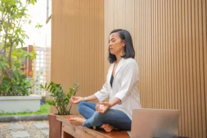 An image of a lady practicins meditation for concentration and focus