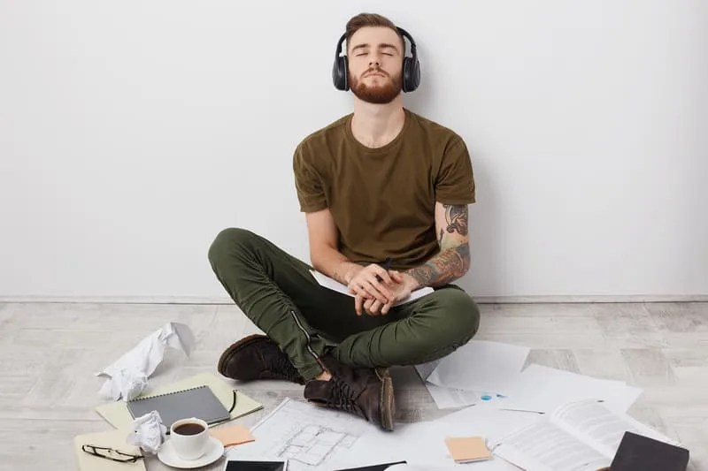 A young man focused, ready to start meditation for concentration and focus