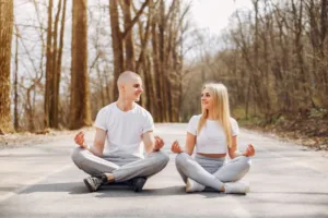 Happy couple meditating together